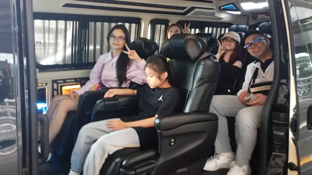 Travelers enjoying a premium city journey in Bangkok with a private LuxMove chauffeur and VIP vehicle.