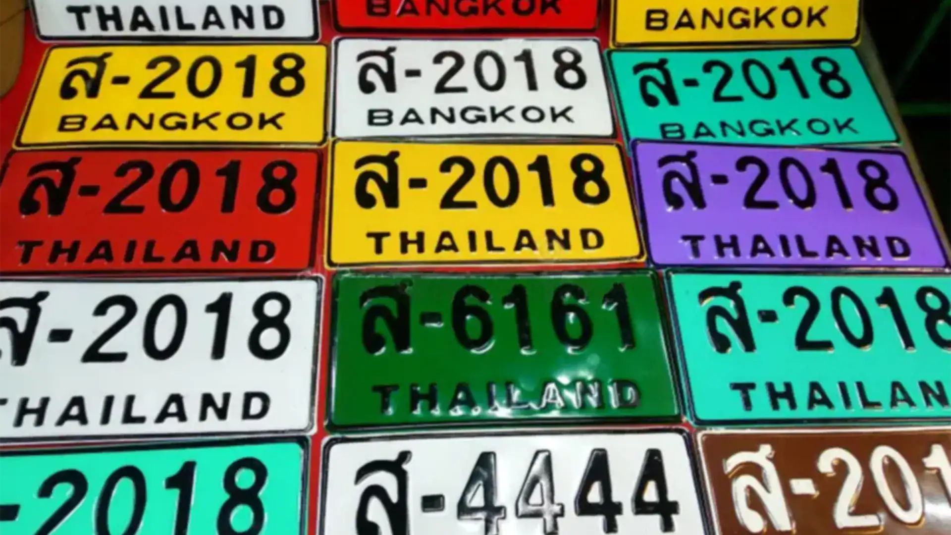 Different Thailand license plate types showing legal distinctions between private and commercial vehicles.
