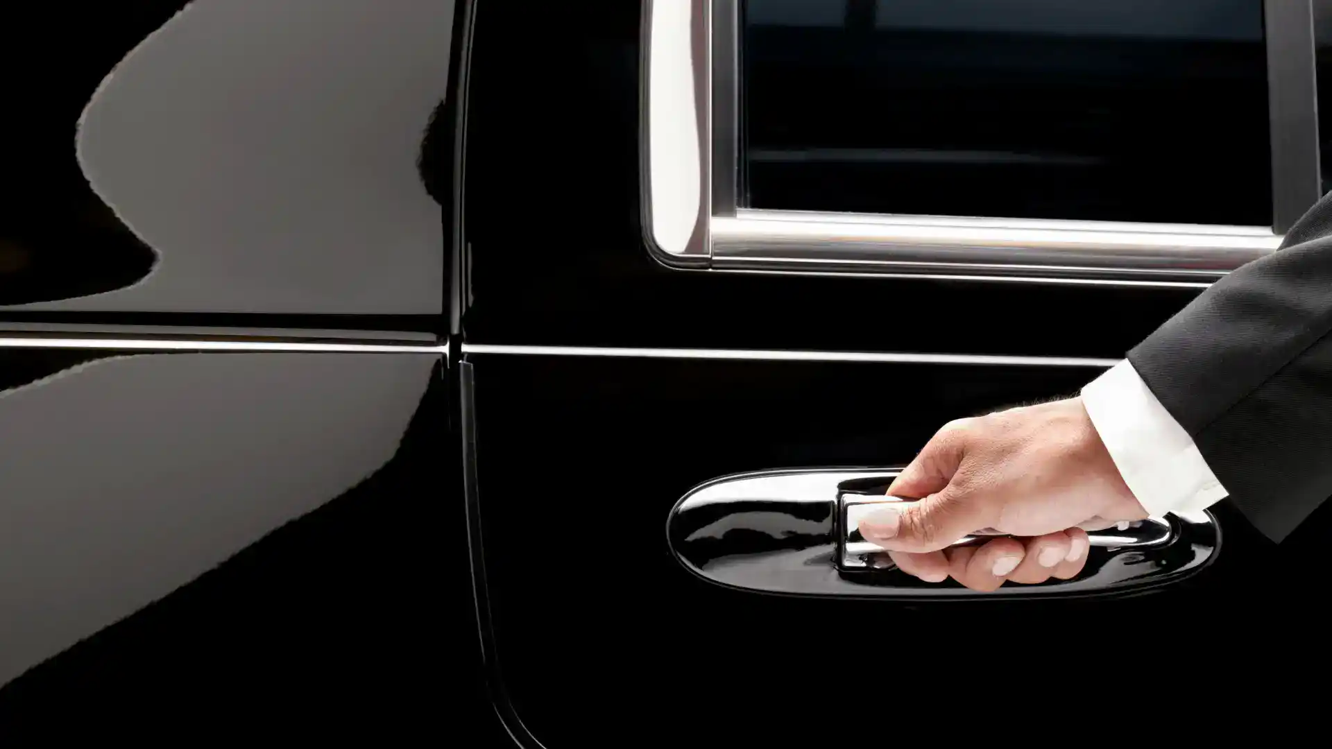 Chauffeur opening the door to a refined luxury limousine travel experience in Thailand.